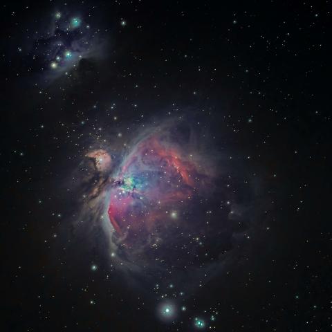 vibrant nebula in space, featuring swirling gas and dust illuminated by a central star.