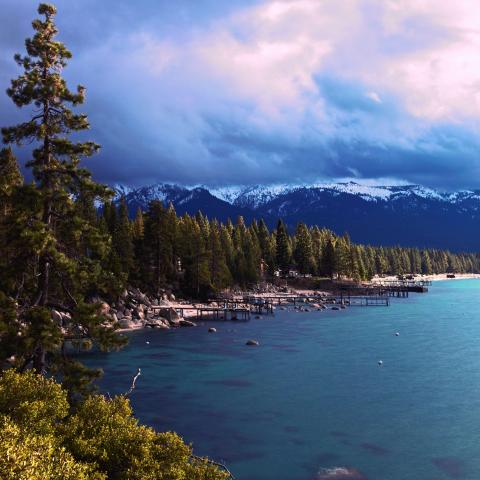 view of a unique and complex system: Lake Tahoe, United States. The Sierra Nevada Mountains surround a large freshwater lake